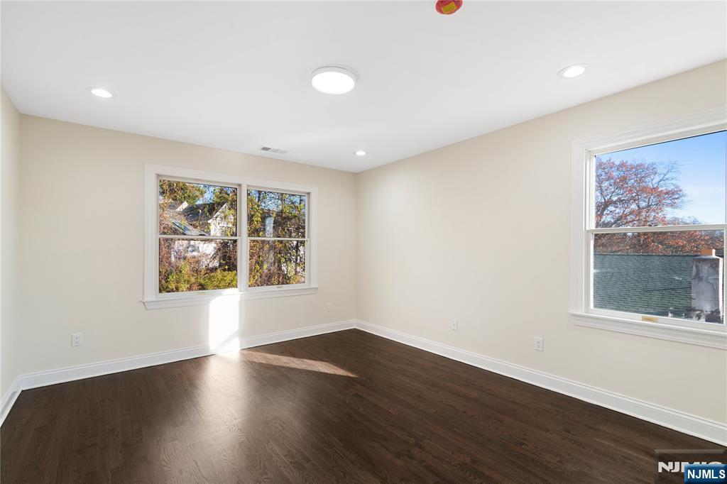 20 Grove Street Boonton, NJ 07005 - Photo 20 of 39 a view of an empty room with wooden floor and a window