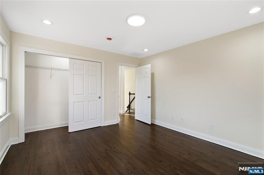 20 Grove Street Boonton, NJ 07005 - Photo 22 of 39 a view of an empty room with wooden floor