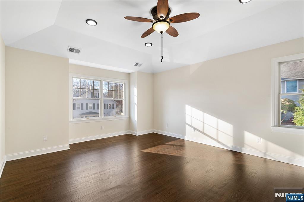20 Grove Street Boonton, NJ 07005 - Photo 24 of 39 a view of an empty room with window and wooden floor