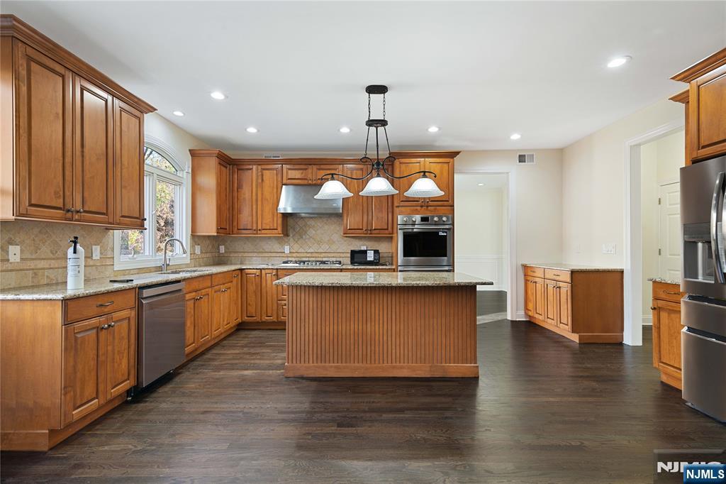 20 Grove Street Boonton, NJ 07005 - Photo 3 of 39 a large kitchen with stainless steel appliances granite countertop a large stove a sink dishwasher and a oven with granite countertops