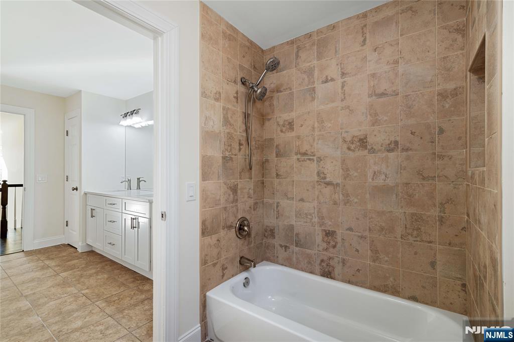 20 Grove Street Boonton, NJ 07005 - Photo 33 of 39 a bathroom with a granite countertop sink a toilet and shower