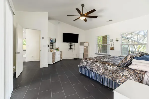 a bathroom with a sink a toilet and a window