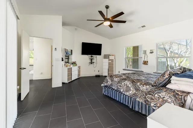 a bathroom with a sink a toilet and a window