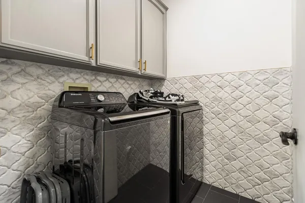 an aerial view of a house with a yard and garden