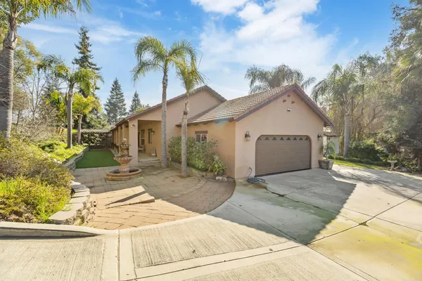 a kitchen with stainless steel appliances a stove a sink and a refrigerator