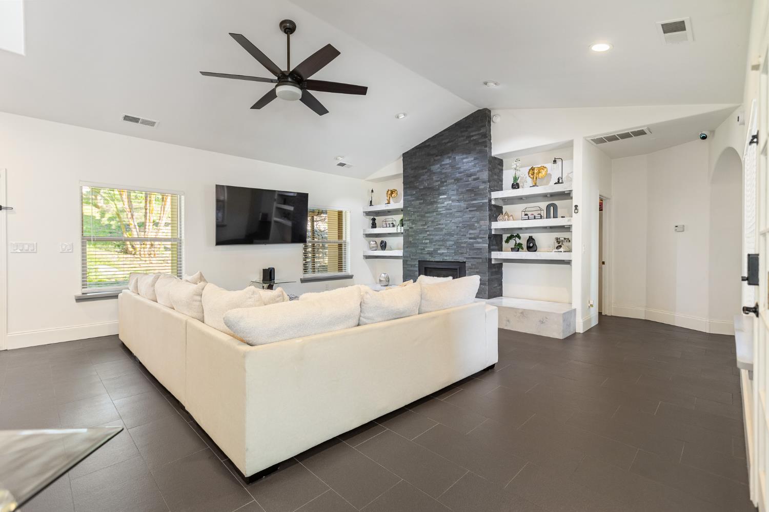 915 South Strathmore Avenue, Unit I Lindsay, CA 93247 - Photo 9 of 51 a living room with furniture and a flat screen tv