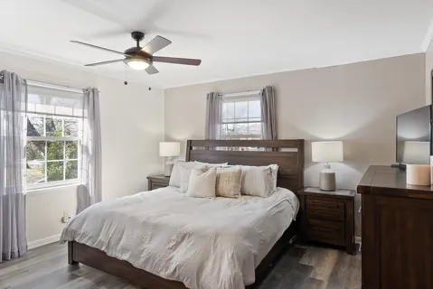 a bedroom with a bed and window