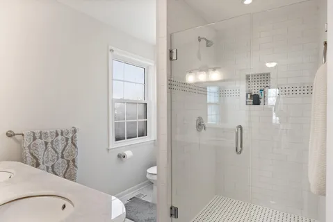 a bathroom with a bathtub and shower