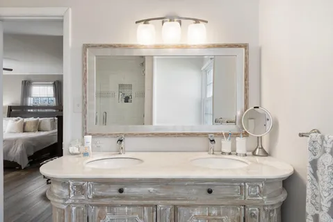 a bathroom with a sink and a mirror
