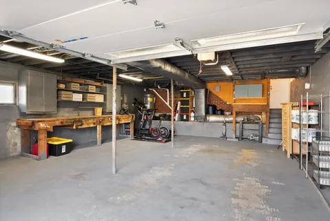 an empty room with lots of wooden furniture