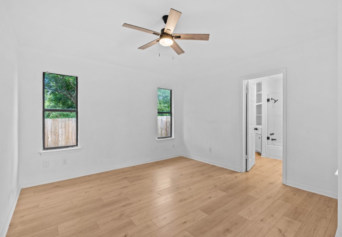 2101 Boxwood Path Round Rock, TX 78664 - Photo 18 of 22 an empty room with fan and windows