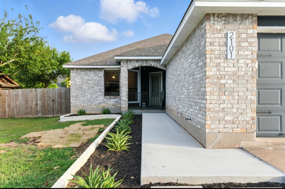 2101 Boxwood Path Round Rock, TX 78664 - Photo 6 of 22 front view of a house with a yard