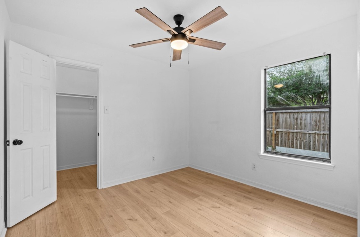 2101 Boxwood Path Round Rock, TX 78664 - Photo 9 of 22 a view of empty room with wooden floor and fan