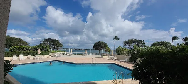 a view of a swimming pool with a patio