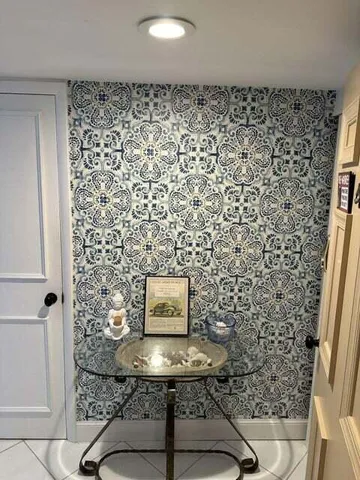 a bathroom with a sink toilet and a mirror