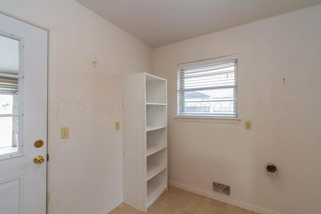 a bathroom with a window and shower