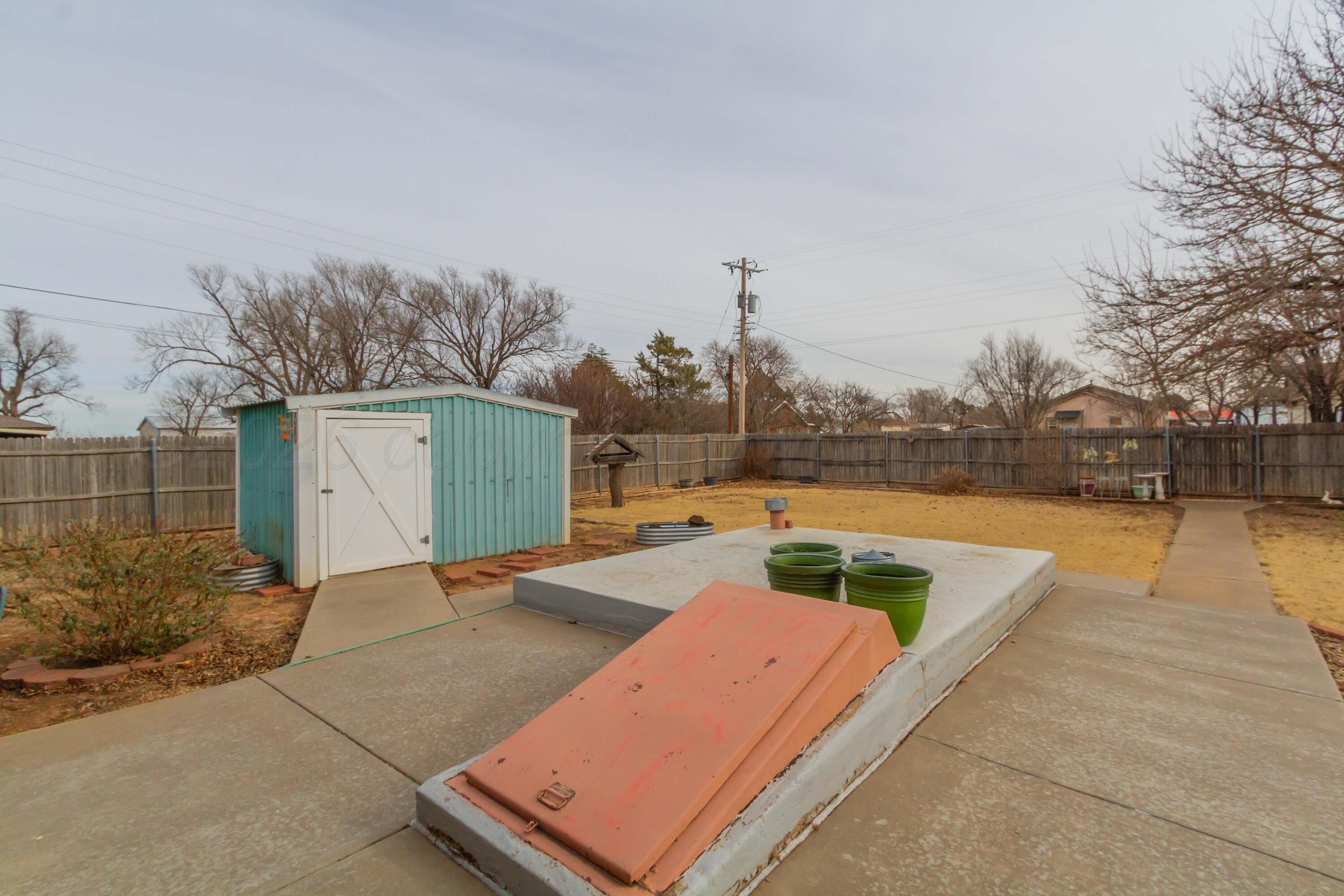 105 Wilson Street Claude, TX 79019 - Photo 30 of 31 a view of a swimming pool with a lounge chairs