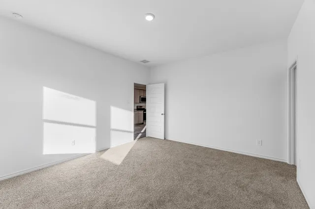 a bathroom with a granite countertop sink a mirror and shower