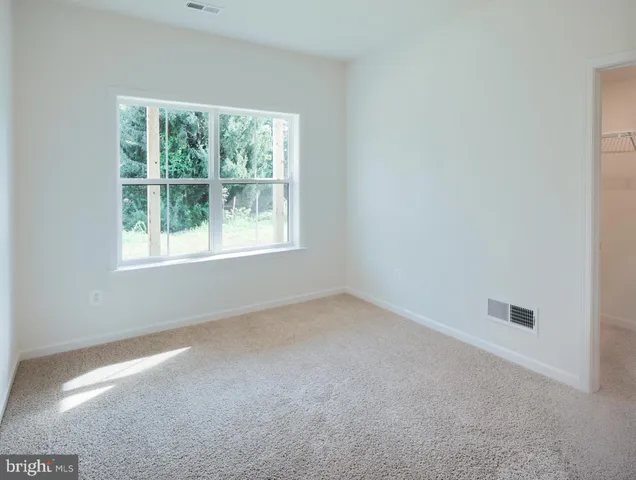 a kitchen with stainless steel appliances granite countertop a stove a sink and a wooden floors