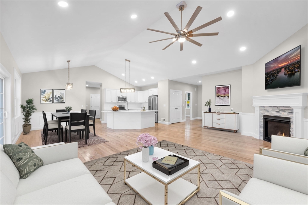 15 High Blf Road Belchertown, MA 01007 - Photo 12 of 41 a living room with furniture a fireplace and a flat screen tv