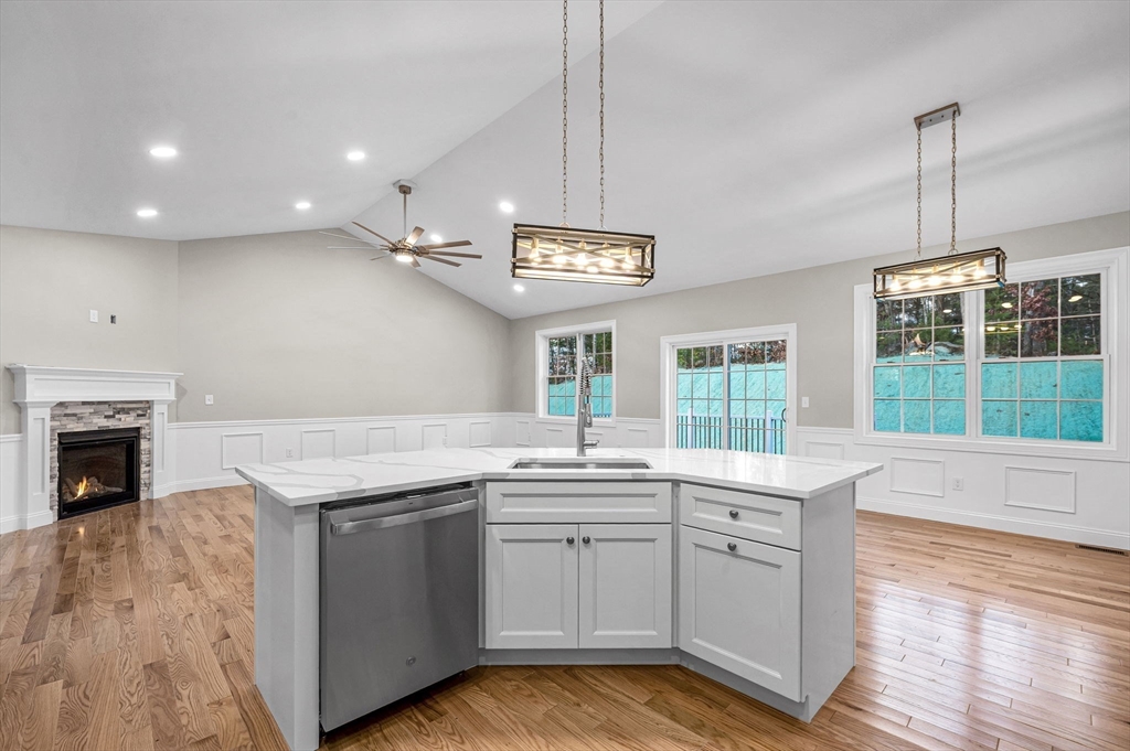 15 High Blf Road Belchertown, MA 01007 - Photo 17 of 41 a kitchen with a sink stove and wooden floor