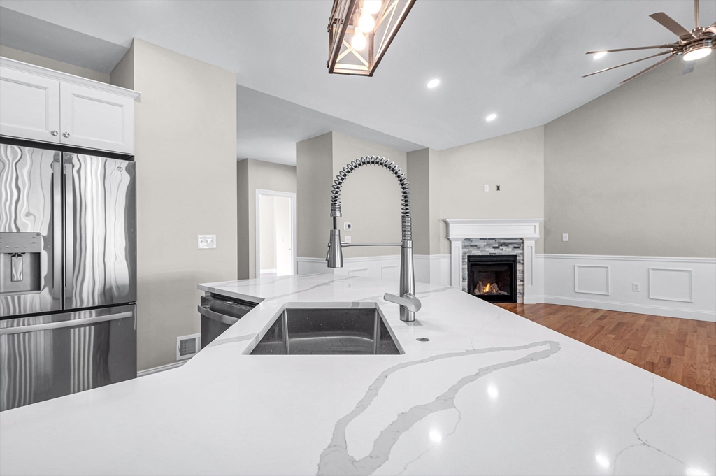 15 High Blf Road Belchertown, MA 01007 - Photo 19 of 41 a kitchen with a stove a refrigerator and a sink