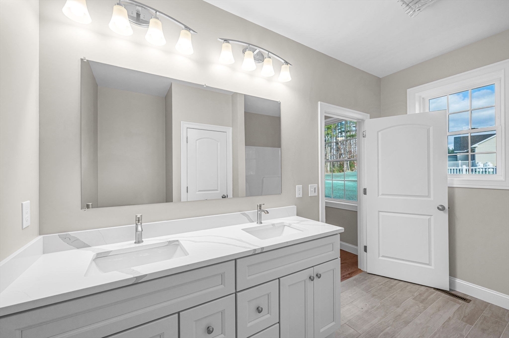 15 High Blf Road Belchertown, MA 01007 - Photo 25 of 41 a bathroom with a sink and a mirror