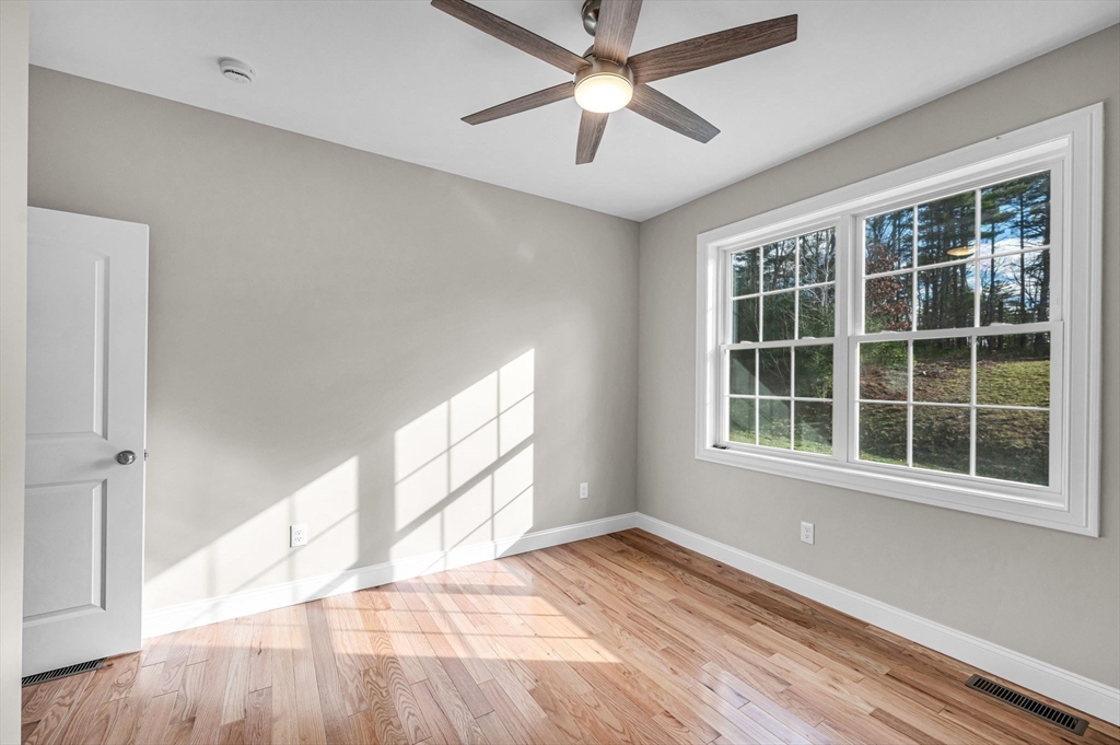 15 High Blf Road Belchertown, MA 01007 - Photo 30 of 41 an empty room with wooden floor and windows