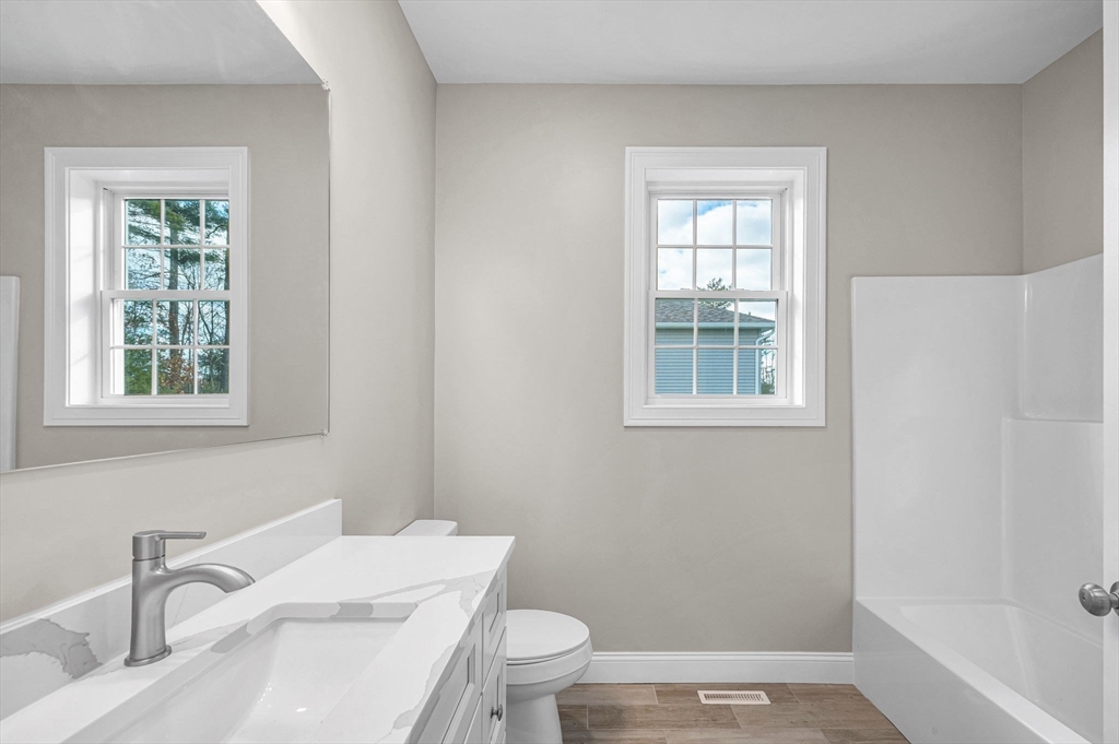 15 High Blf Road Belchertown, MA 01007 - Photo 31 of 41 a bathroom with a sink toilet and window