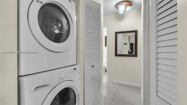 a view of a hallway with washer and dryer
