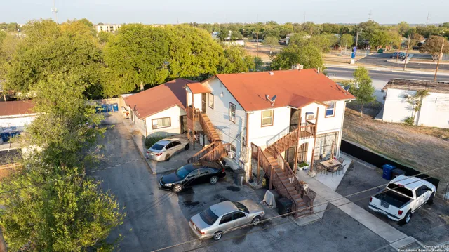 an aerial view of a house with a garden