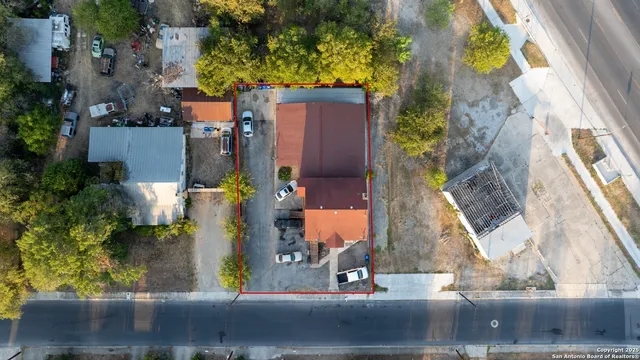 an aerial view of residential houses with outdoor space