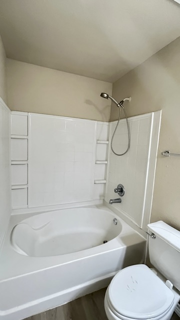 5211 Viewpoint Drive Austin, TX 78744 - Photo 12 of 25 a bathroom with a toilet and a bath tub