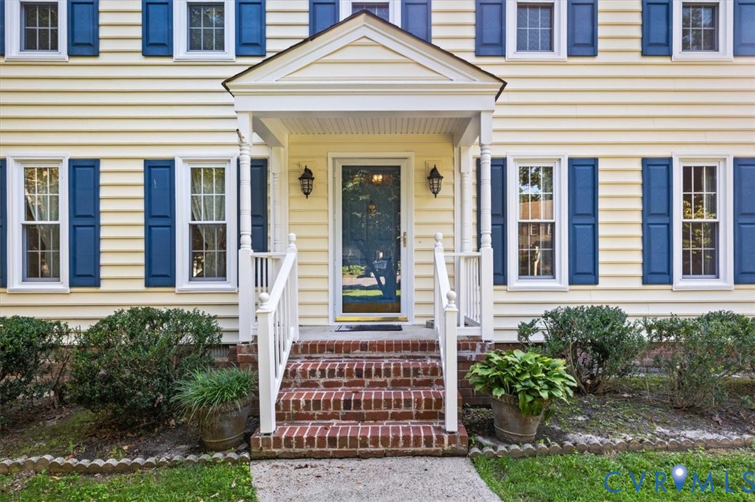13905 Shadow Ridge Lane Midlothian, VA 23112 - Photo 4 of 55 Siding exterior with blue shutters, brick entry st