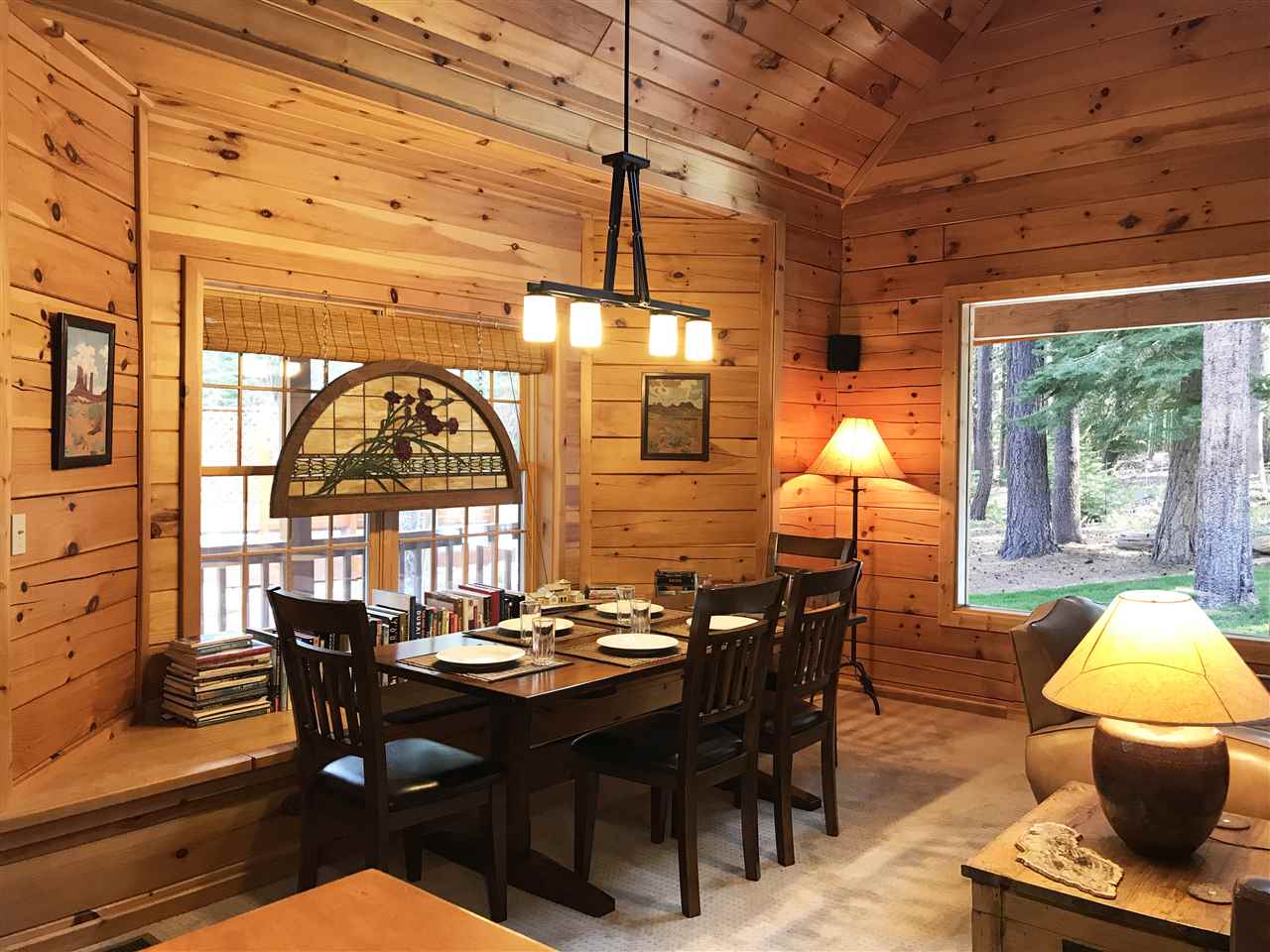 12051 Oslo Drive Truckee, CA 96161 - Photo 12 of 21 a view of a dining room with furniture a chandelier and wooden floor
