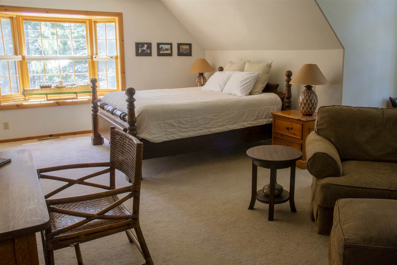 12051 Oslo Drive Truckee, CA 96161 - Photo 15 of 21 a bedroom with a bed and a couch next to a window