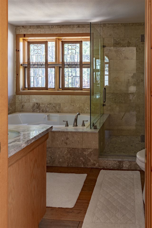 12051 Oslo Drive Truckee, CA 96161 - Photo 17 of 21 a view of a bathroom with a granite countertop sink