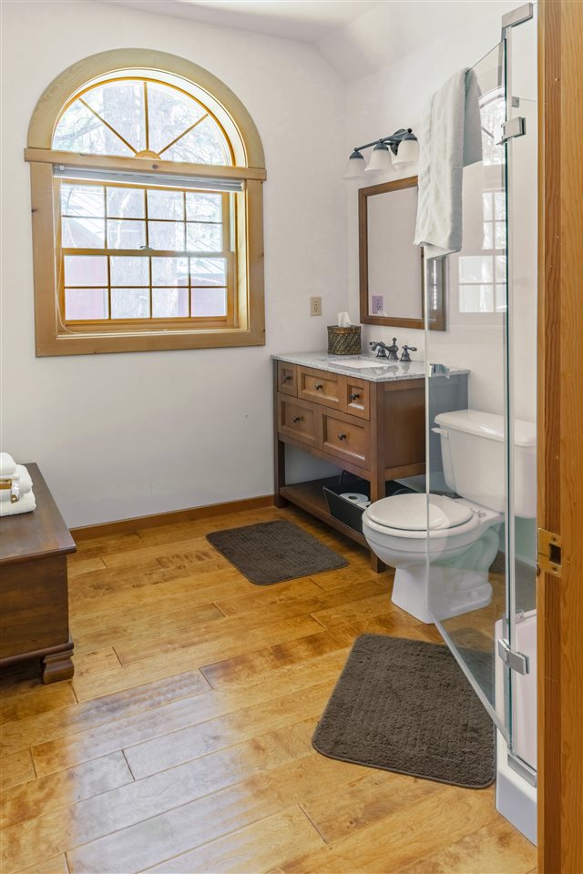 12051 Oslo Drive Truckee, CA 96161 - Photo 20 of 21 a bathroom with a sink a toilet and a window