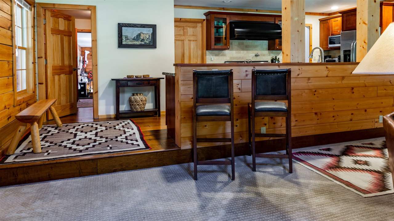 12051 Oslo Drive Truckee, CA 96161 - Photo 9 of 21 a living room with furniture and a flat screen tv