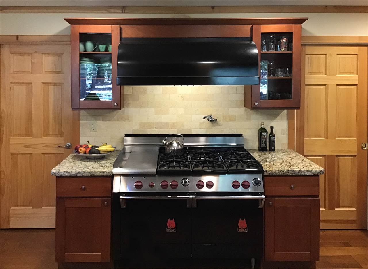 12051 Oslo Drive Truckee, CA 96161 - Photo 10 of 21 a stove top oven sitting inside of a kitchen