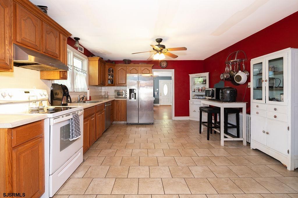 19 South 1st Road Hammonton, NJ 08037 - Photo 12 of 36 a kitchen with a sink a stove and cabinets