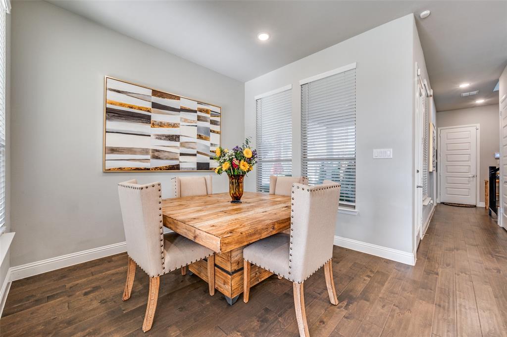 8977 George Cayley Lane Frisco, TX 75034 - Photo 7 of 24 Dining nook adjacent to the kitchen for convenience and connecting main living and gathering spaces