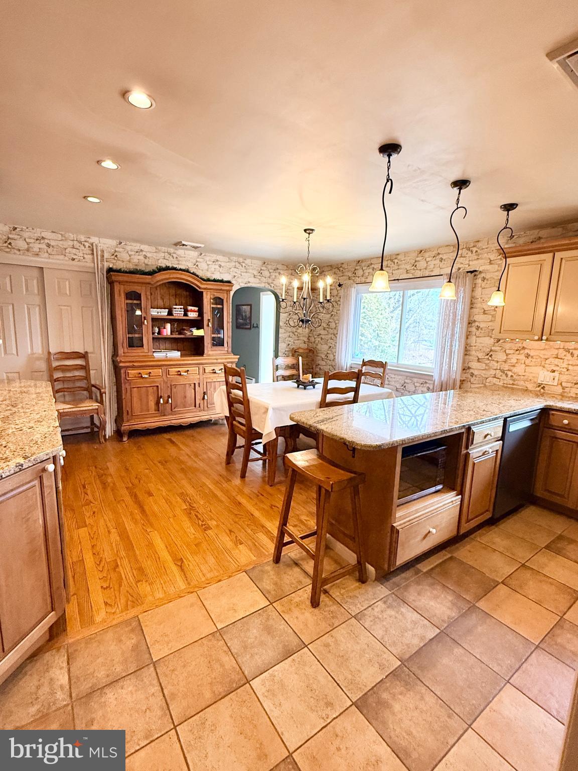 2360 New Schuylkill Road Pottstown, PA 19465 - Photo 16 of 36 a living room with stainless steel appliances kitchen island granite countertop furniture and a view of living room