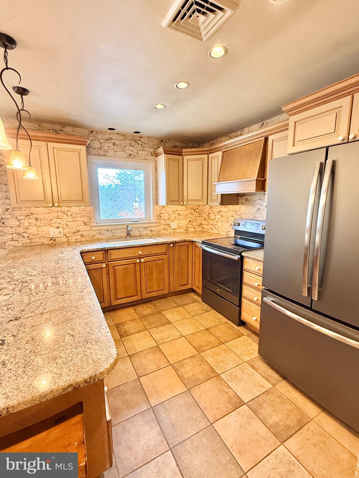 2360 New Schuylkill Road Pottstown, PA 19465 - Photo 20 of 36 a kitchen with stainless steel appliances granite countertop a sink stove and refrigerator