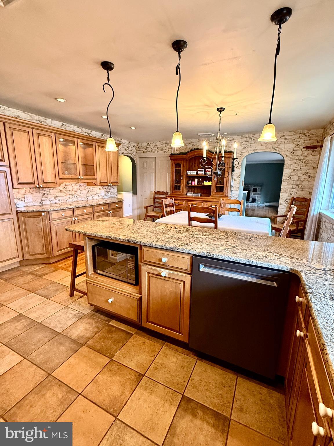 2360 New Schuylkill Road Pottstown, PA 19465 - Photo 21 of 36 a kitchen with stainless steel appliances granite countertop a stove a sink and a microwave