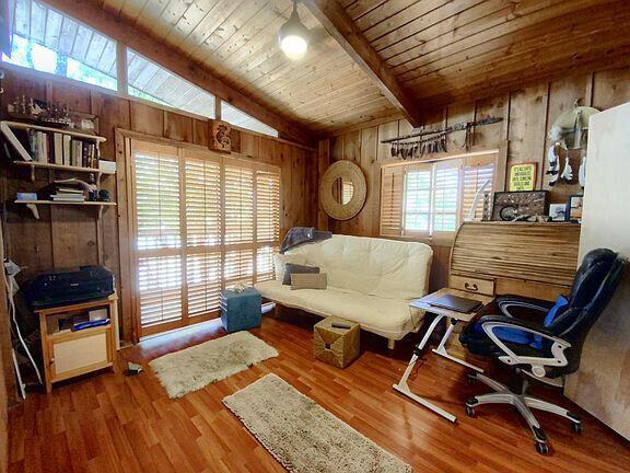 136 Palermo Drive Islamorada, FL 33036 - Photo 25 of 38 a living room with furniture and wooden floor