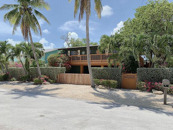 136 Palermo Drive Islamorada, FL 33036 - Photo 3 of 38 a view of a backyard with a patio