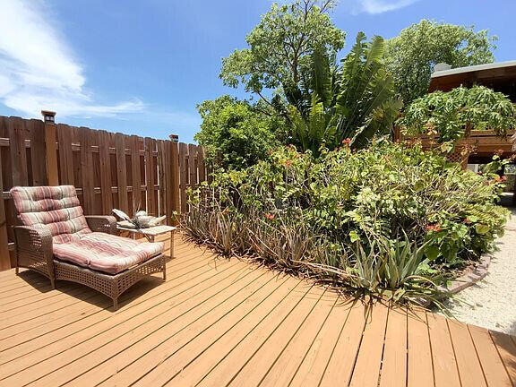 136 Palermo Drive Islamorada, FL 33036 - Photo 37 of 38 a view of backyard with a deck and wooden floor
