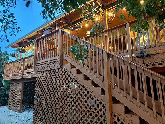 136 Palermo Drive Islamorada, FL 33036 - Photo 8 of 38 a view of entryway with wooden stairs