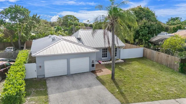 an aerial view of a house with swimming pool